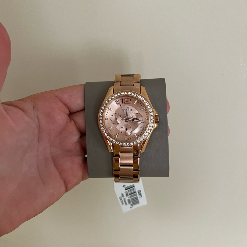Brand new rose gold fossil watch. With case. $115 obo